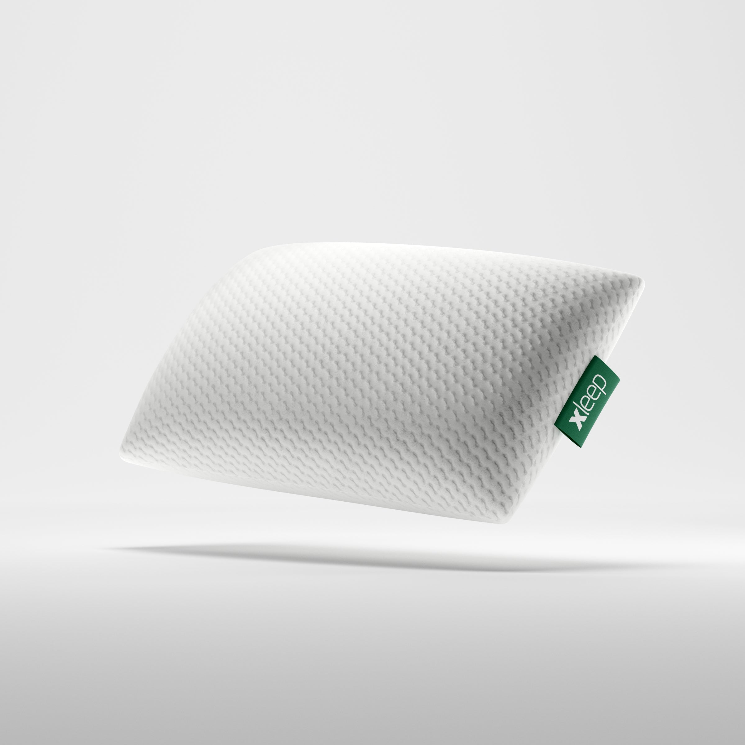 Orthopädisches Xleep CoolXleep Kopfkissen mit strukturiertem weißen Bezug und grünem Marken-Logo.