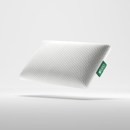 Atmungsaktives Xleep AirXleep Hybrid-Kopfkissen mit weißem strukturiertem Bezug und grünem Marken-Logo.
